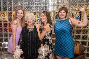 A group of women pose for a photo in the Gordon Art Galleries.